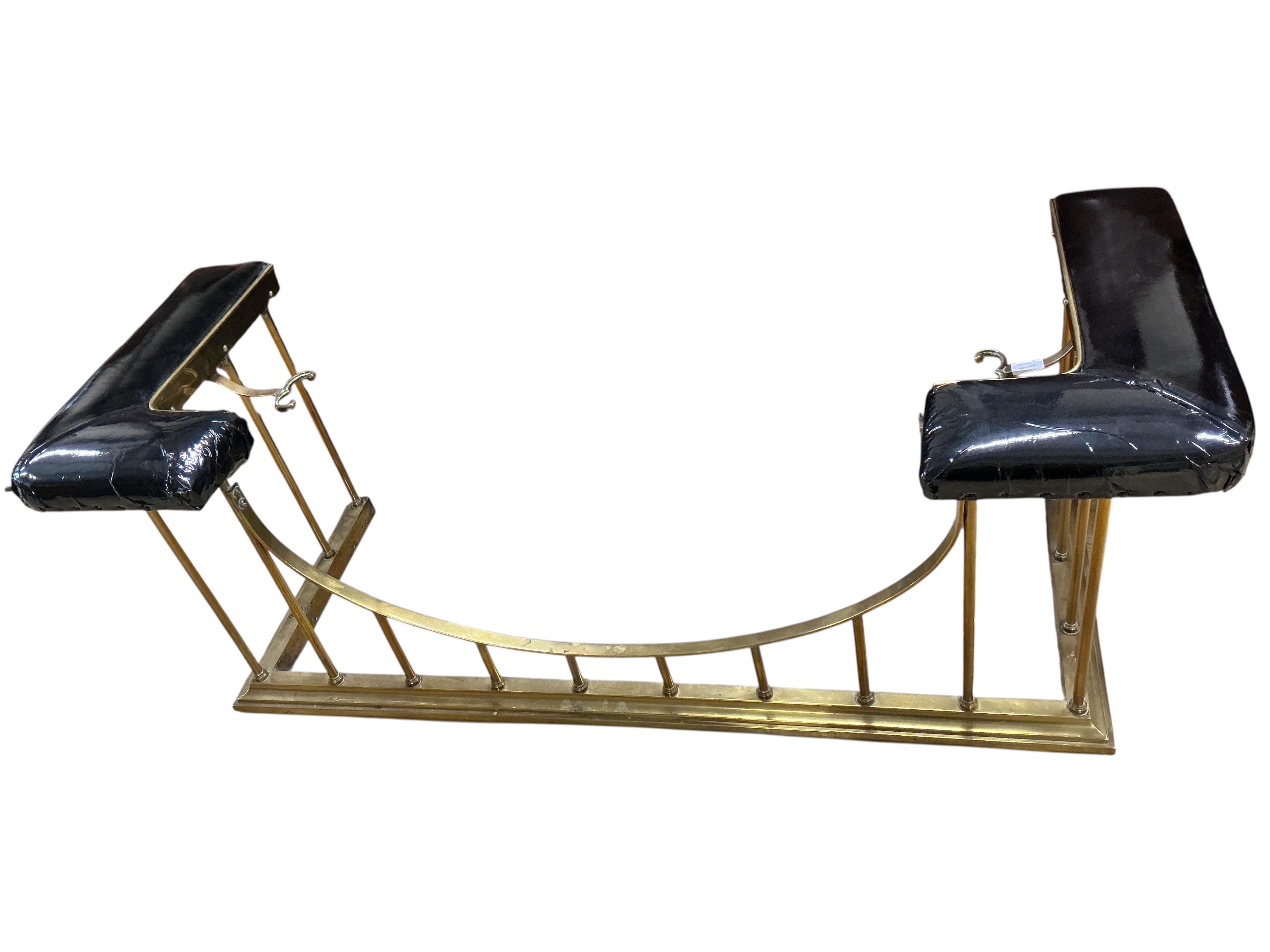 A late Victorian brass club fender, in need of re-upholstering, width 160cm, depth 60cm, height 59cm